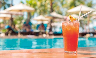 A cocktail beside a swimming pool